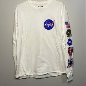 White NASA Long Sleeve Tee with Mission Insignias on Sleeve.